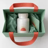 Custom sealed supplement bottle packaging — Ribbon-handle paper bag — Interior & handles