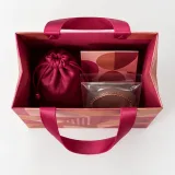 Custom jewelry pouch packaging — Ribbon-handle paper bag — Interior & handles