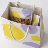 Sealed granola pouch — Cord-handle paper bag