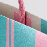 Custom travel accessories packaging — Twisted-paper handle bag — Paper & finish