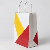 Custom client welcome kit packaging — Twisted-paper handle bag — Side gusset