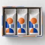 Custom coffee pouches packaging — Paperboard sleeve and tray — Product & insert