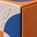 Custom honey jar packaging — Paperboard sleeve and tray — Material & finish