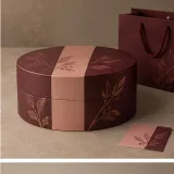 Custom celebration chocolate packaging — Round lift-off box — Side / rear