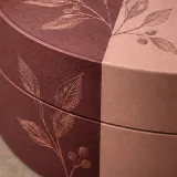 Custom celebration chocolate packaging — Round lift-off box — Material & finish